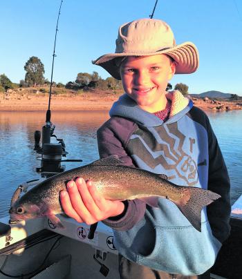 Young Edward Keys with his first ever trout – what an achievement!