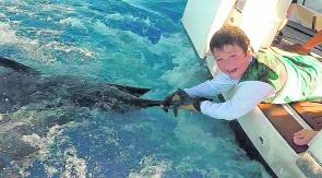 Who’s a happy camper then! Twelve-year-old Flynn Young with his first marlin, a blue, caught off Better Than Vegas back in March. (Pic by Pete English.)