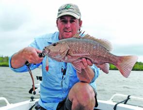 Craig Griffiths shows off a cracker jack caught in late January when the river waters were still brown and dirty.