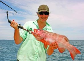 Sarah Giblin with a 65cm coral trout caught on a live bait around one of Cooktown’s headlands.