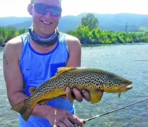 Brenton Richardson with a lovely Kiewa River brown trout taken on a Super Vibrax bladed spinner.