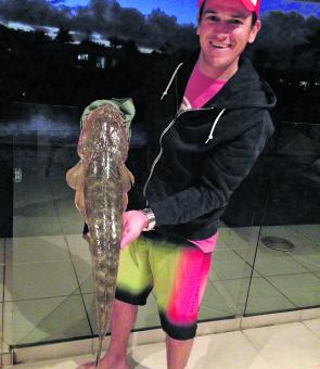 Damien with a quality flathead caught in Mooloolaba.