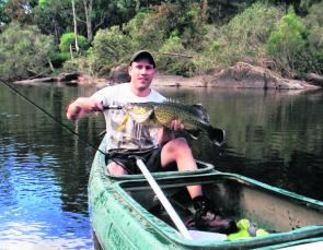 Shane Lockwood uses a canoe during Summer to access water too difficult to fish from the bank, regularly scoring fish like this fat little cod. 