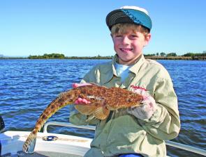 Sam Poulton with his PB flathead, caught jigging deep around Dennis Bridge.