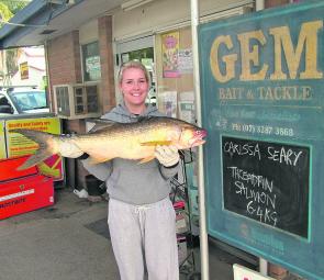 Carissa Seary with a 6.7kg king threadfin salmon she caught from the Pin.