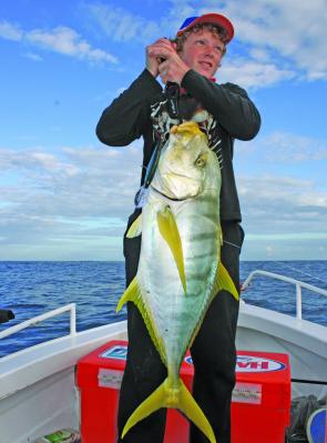 The author’s son Matthew Magner with a typical golden trevally trolled offshore from Bundaberg.
