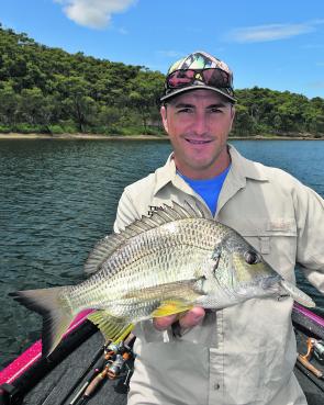 Local angling identity Glenn Helmers with a Lake Macquarie bream caught by working a surface lure along a rocky point. This fish was hooked mid-morning, but it generally pays to be on the water nice and early.