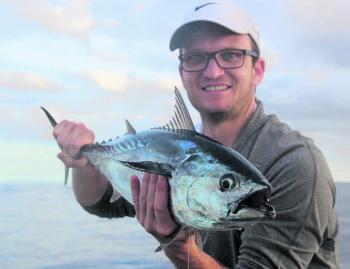 Luke Goody with a mac tuna caught casting at a surface bust up. These fish are built for speed and can really pull some drag!