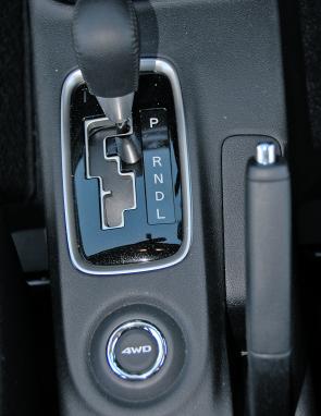 Four wheel drive can be locked in via a console mounted button. 