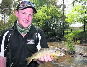 Brenton Richardson with a typically compact brown trout caught in a small stream on a bladed spinner early last season.