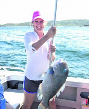 Kelly Vogel with a blue tuskfish.