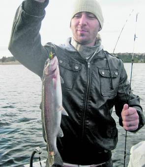 Ari Small with a rainbow caught on one of the new Bullet lures.