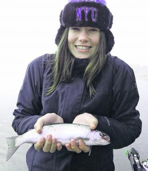 Nina Kettle keeps warm as she boats another rainbow.