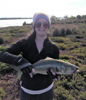 Rachael Wangman with a thumping big salmon casting metal lures in McLoughlins Beach entrance weighing 2.5kg.