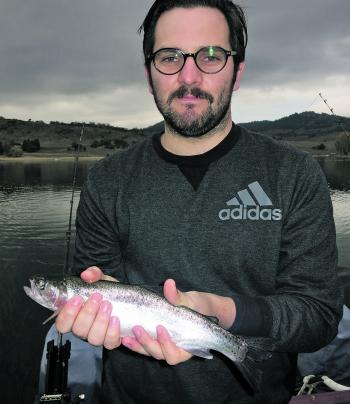 Matt Peterson with a rainbow trout caught trolling.