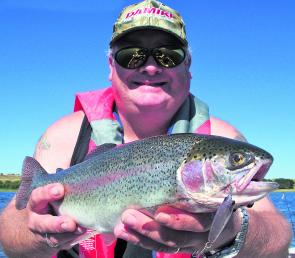 The author with an Elingamite rainbow taken on a Damiki Saemi minnow lure.