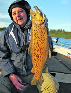 A well-equipped trout trolling tinnie will improve your chances at trophy fish like this hook jawed male. For a few hundred dollars you’ll have well configured rod placements, convenient rod storage and a few tricks to land that fish of a lifetime. 
