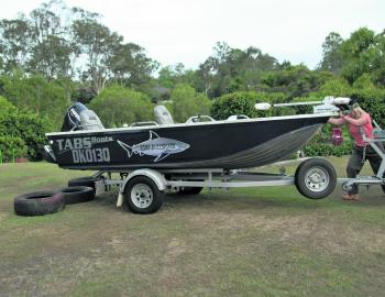 With a good trailer, the boat won’t take much effort to shift back. Denise is moving it fairly easily. Note the controlled amount of slack in the winch cable. 