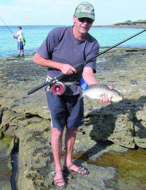 Owen with one of the nine luderick he caught while fishing in very calm seas. The berley made the difference.