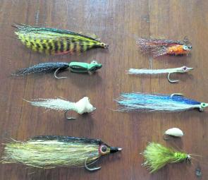 If the author was to do a trip up and down the coast with a small outfit, these are the flies he would take. Clockwise from top left: Bendback Fly, Grabham’s Gurgler (with eyes), Dahlberg Diver, Gold Bomber Fly, Olive Woolly Bugger, Deer Hair Bread Patter