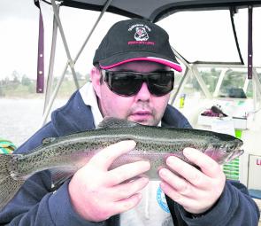Luke Taylor with a nice rainbow trout caught on a number 111 Willys Special Tasmanian Devil.