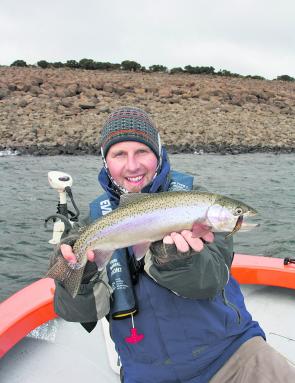 Brendan Turriff with a spanking rainbow trout. Using soft plastics on rough May days is a reliable way to fill the creel.
