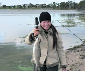 Horsham angler Eunice Santiago with a decent rainbow she caught at Natimuk Lake on Powerbait.