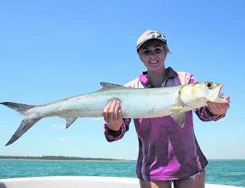Ashleigh Willis with a cracker of a giant herring caught while hunting golden snapper.