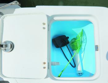 While not holding live bait, this live bait tank holds the earmuffs for the outboard.