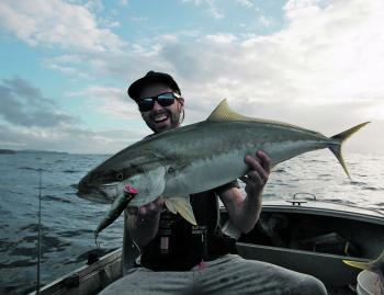 Harry Burrows and his kingfish caught off the surface.