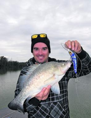 Jason Stevens with a typical golden perch that bit off a bit more than it could chew.