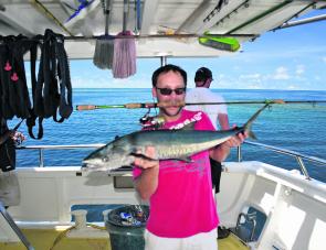 A small Spanish mackerel caught on light gear next to a reef edge.