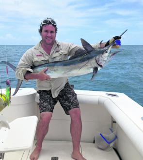 Corey Hargreaves with a black marlin. There have been unprecedented numbers off Bundaberg and Hervey Bay recently.