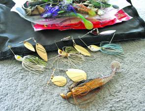 Spinnerbaits come in all sizes. The top three will catch most freshwater species while the bottom ait is bigger and designed specifically for cod. Notice the trailing stinger hooks which hang just behind the skirt material. Short striking fish beware!
