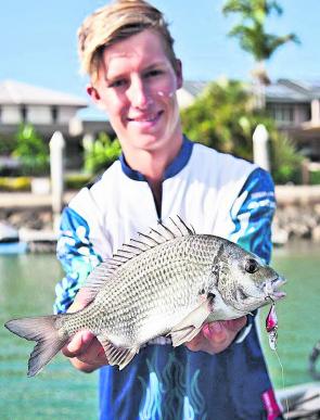 James Howarth with a good sized bream from the Raby Bay canals. The water is gin clear at Raby Bay so light line is a must.