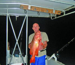 Andrew Carter from Brisbane with a magnificent mangrove jack taken off a Cairns’ reef.
