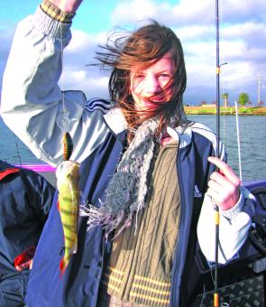 Brianna Vasica with her first ever fish, caught on a very windy day at Lake Mulwala.