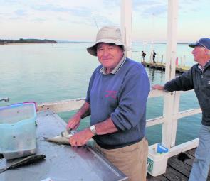 Colin from South Australia cleans his catch after a great fishing trip.