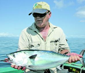 Col Upham holds up a beautiful Cairns bonito (tuna) of about 4kg taken on a small slice. These fish with their speedy, powerful capabilities are great fun for any angler on medium spin gear.