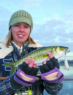 Rugged up for some cool conditions, Katrina Paton displays a typical Barwon River salmon taken on a walk-the-dog style surface lure.
