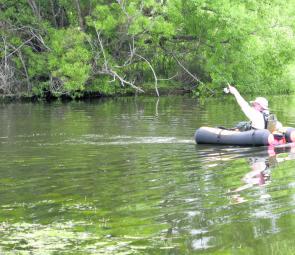 Local small impoundments will fire up for trout over the coming month. Here the author tangles with a rainbow from the ‘comfort’ of a float tube.