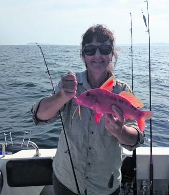 Amanda Kelliar with a red mullet or the ‘chicken of the sea,’ as they are known.