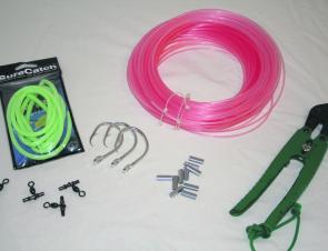 All the requirements to make up a deep drop rig. A roll of 300lb mono, some crimps and swivels to suit, 16/0 Mustad circle hooks and a roll of glow tubing.