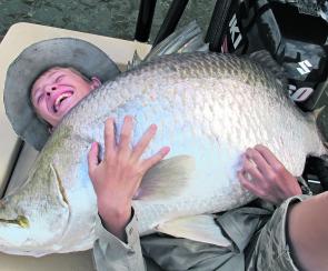 The determined 12 year old Jackson Bargenquast hugging the fish of a lifetime, 132 cm of wild barra!