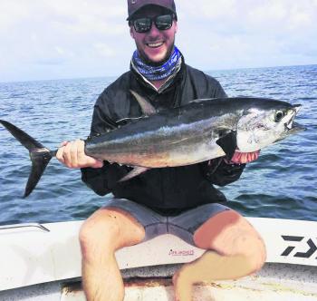 Sam Bateman with his first ever longtail tuna. This fish took one of the author’s Sweepshot Stickbaits slowly worked through some aggressively feeding fish.