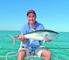 Mick Jones with a tuna taken on 4kg spin gear and small metal slice.
