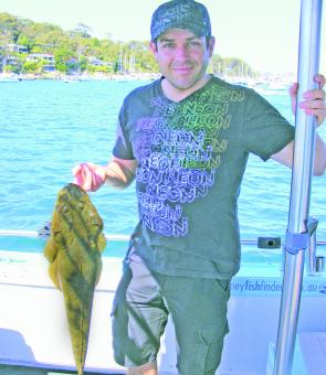 Stuart Quinlan with a 75cm flathead before release. It took a white 12” Slug-Go soft stickbait more suited to kingfish.
