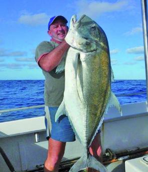 Ian Garret with a giant trevally trolled up on the shoals.