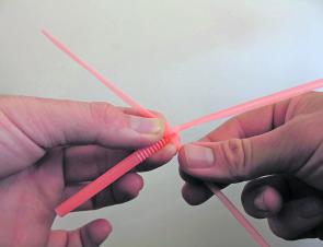 Take both sides and crease backwards on itself pointing up, these will be the legs. Whilst pinching the straw legs up, perform the same loop pattern on the original side. Change sides and repeat, make sure you pinch the leg segment up while you loop, pull
