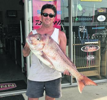 Dominic Vidot with a cracking 8kg+ red caught on a live slimy off Port Macquarie.